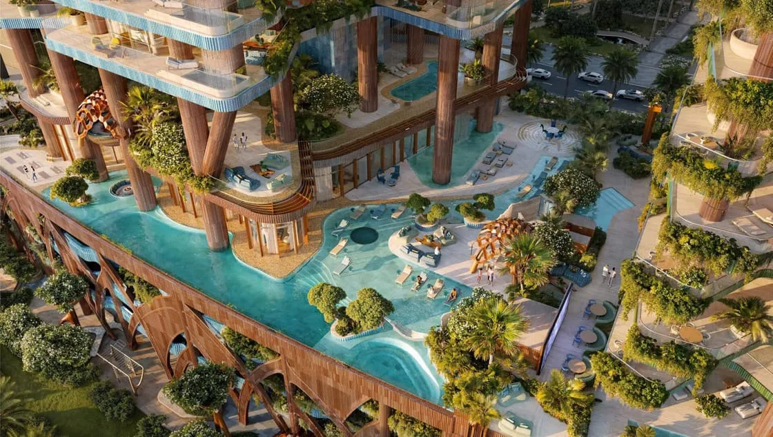 Seen from above, pools and gardens winding through the podium terraces between the two towers