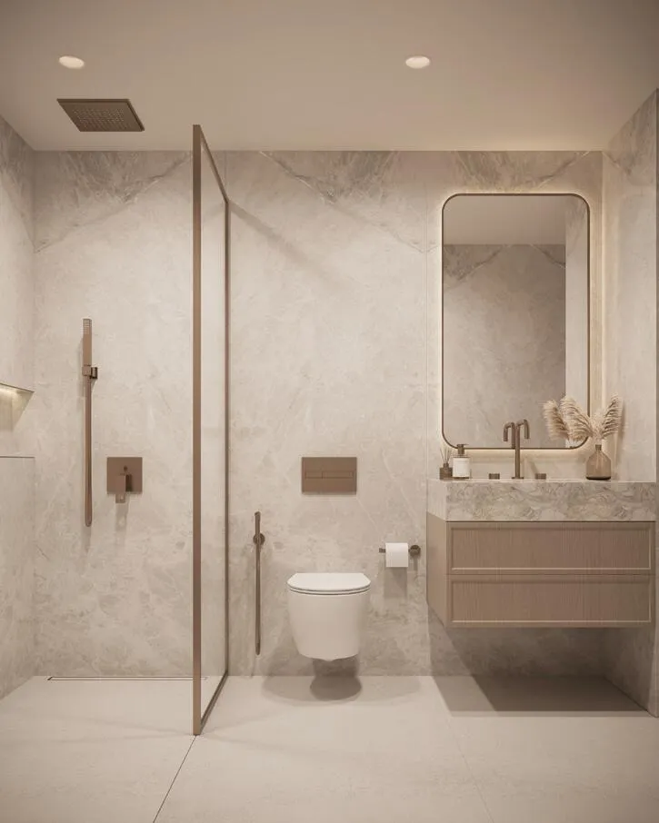 A marble-toned bathroom with a glass-enclosed shower stall and a single vanity