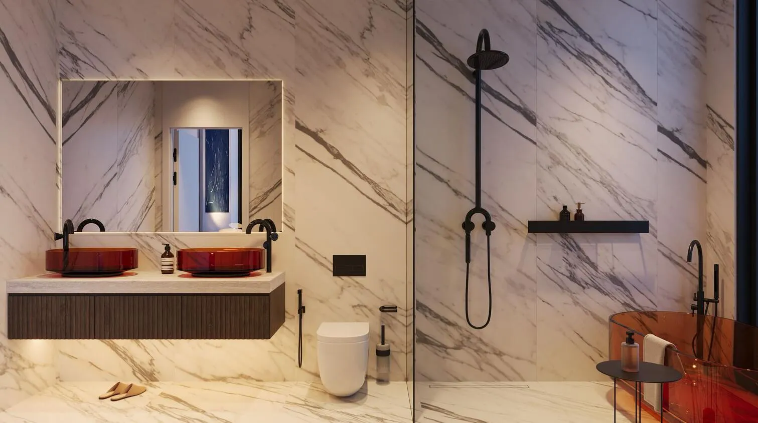 A marble bathroom with a red stone basin under a lit mirror and a walk-in shower with black fittings