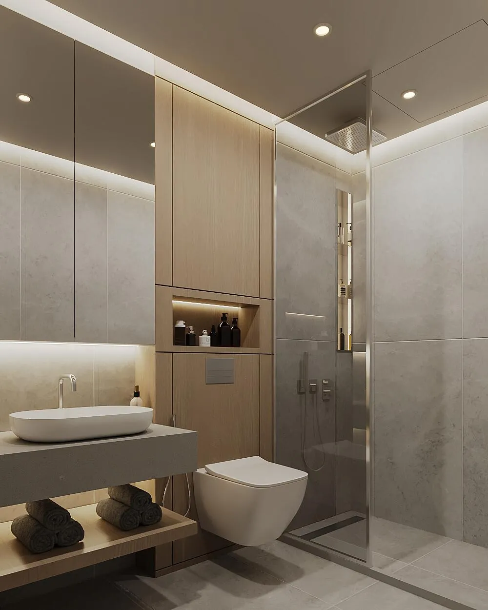 A stone vanity top with an undermounted basin, a slim mirror and warm cove lighting above