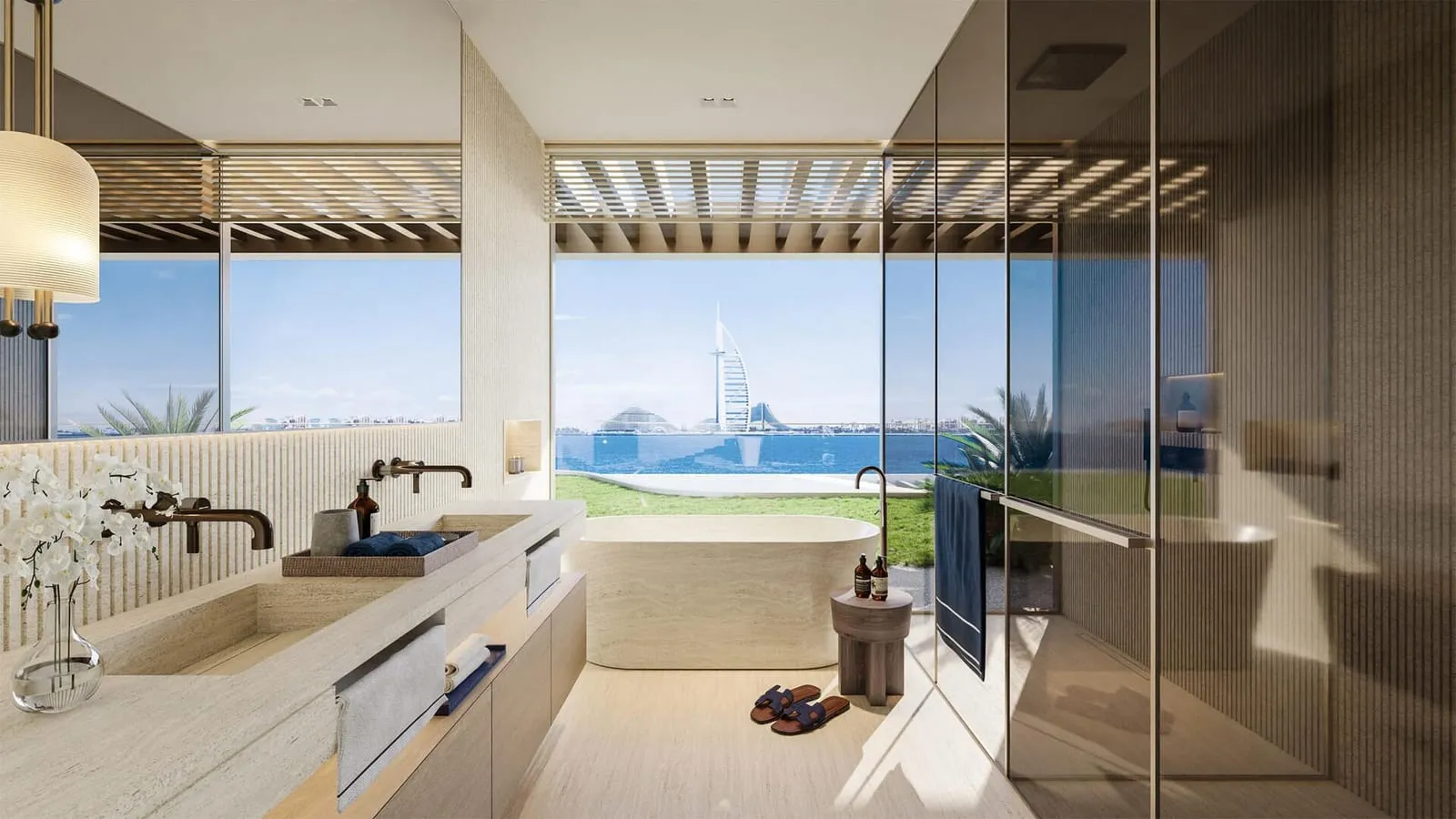 A bathroom with the window framing Burj Al Arab across the water