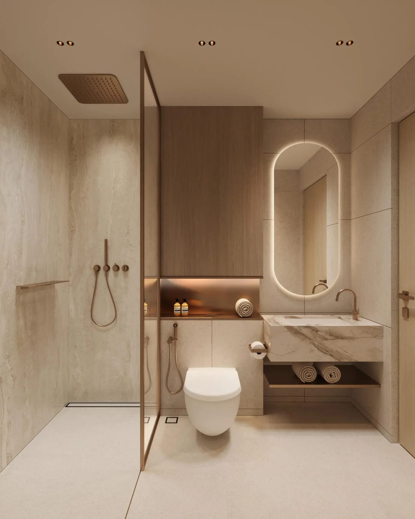 A bathroom in pale stone, a walk-in shower behind glass and an oval backlit mirror over the vanity