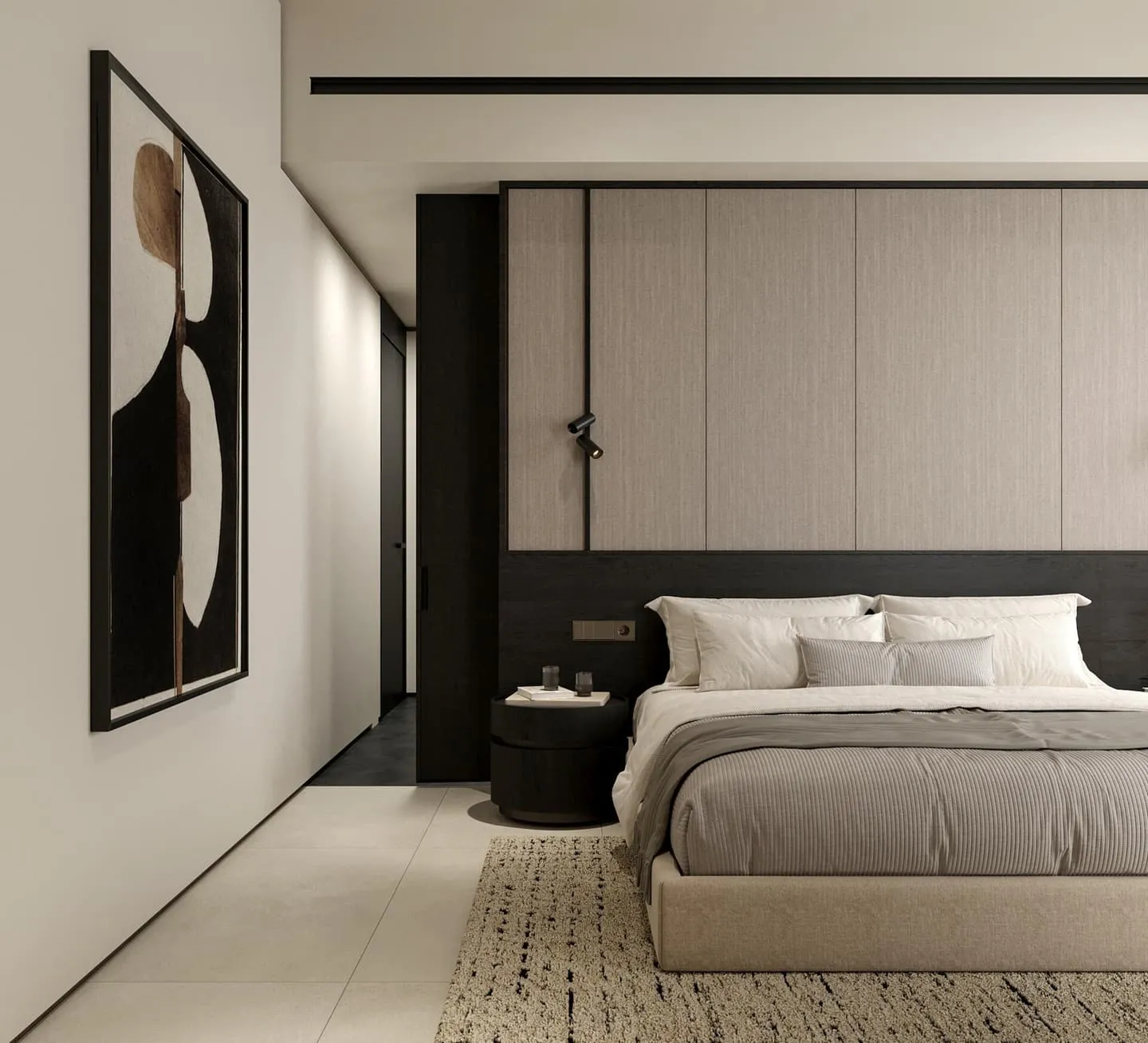 A bedroom with an abstract print above the bed and a bedside lamp on a dark table