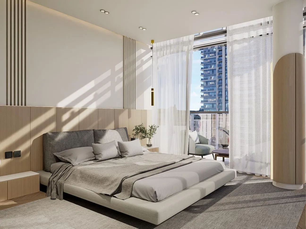 A second bedroom styled with grey linens and a textured accent wall behind the bed