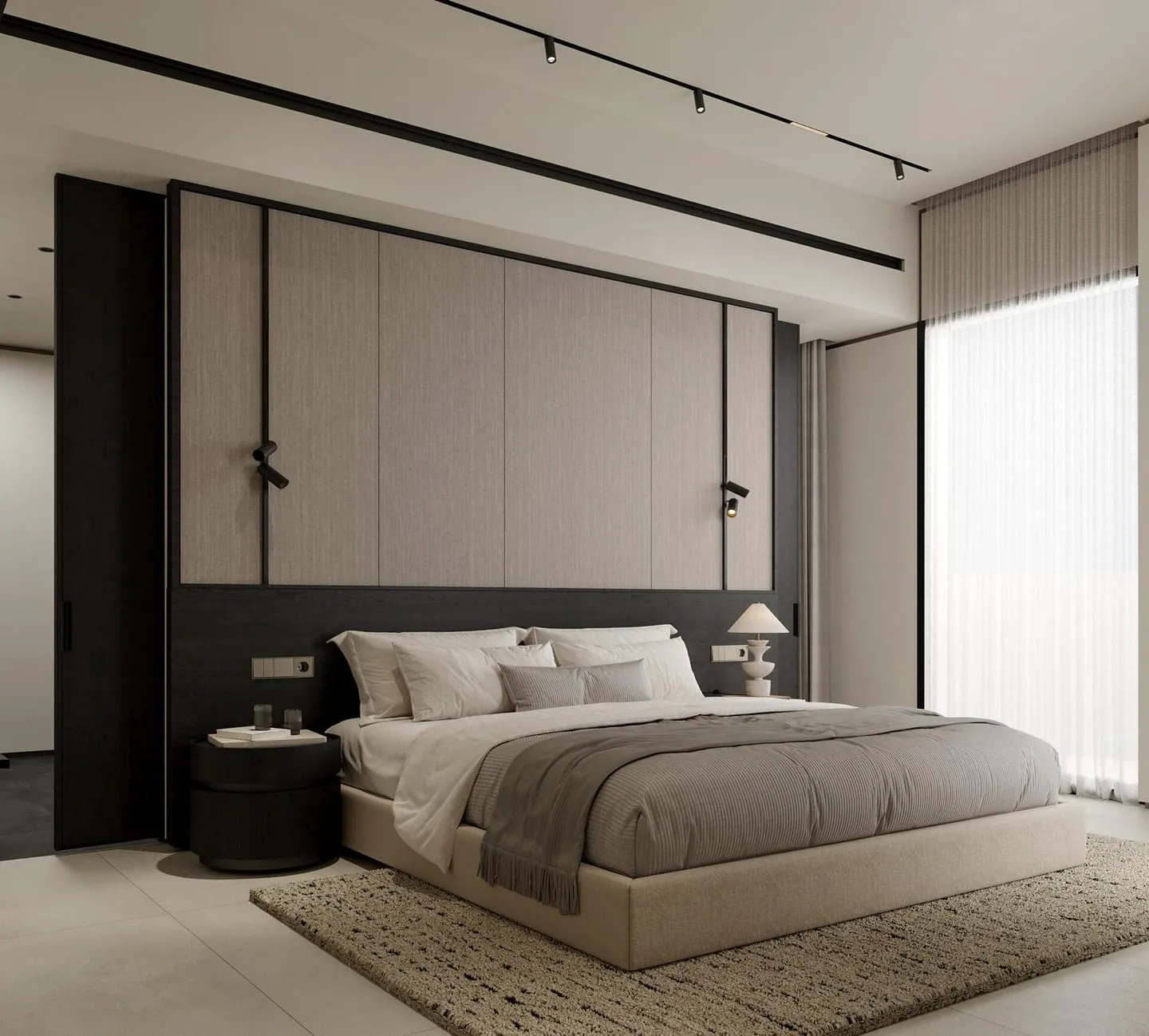 A bedroom with a timber-panelled headboard wall and framed artwork either side of the bed