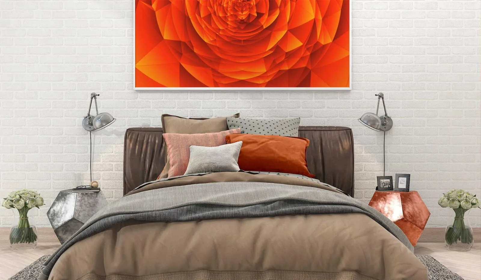 A bedroom with a large rose photograph above the bed and reading lamps on the white brick wall