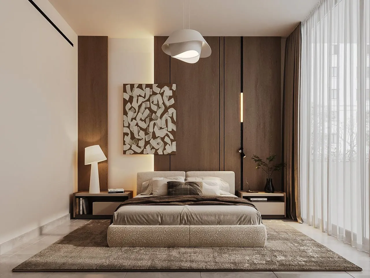 A bedroom with an upholstered headboard, matched bedside lamps and a framed print above