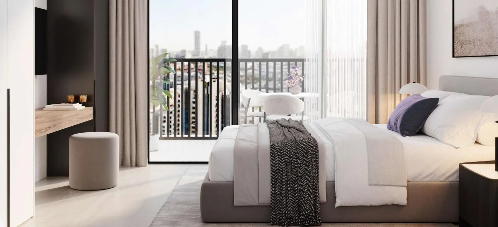 A bedroom with its balcony door open, a niche of shelving beside the bed