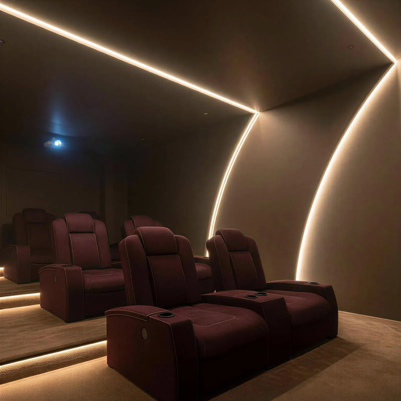 A private cinema room with reclining seats beneath a curved backlit ceiling arc