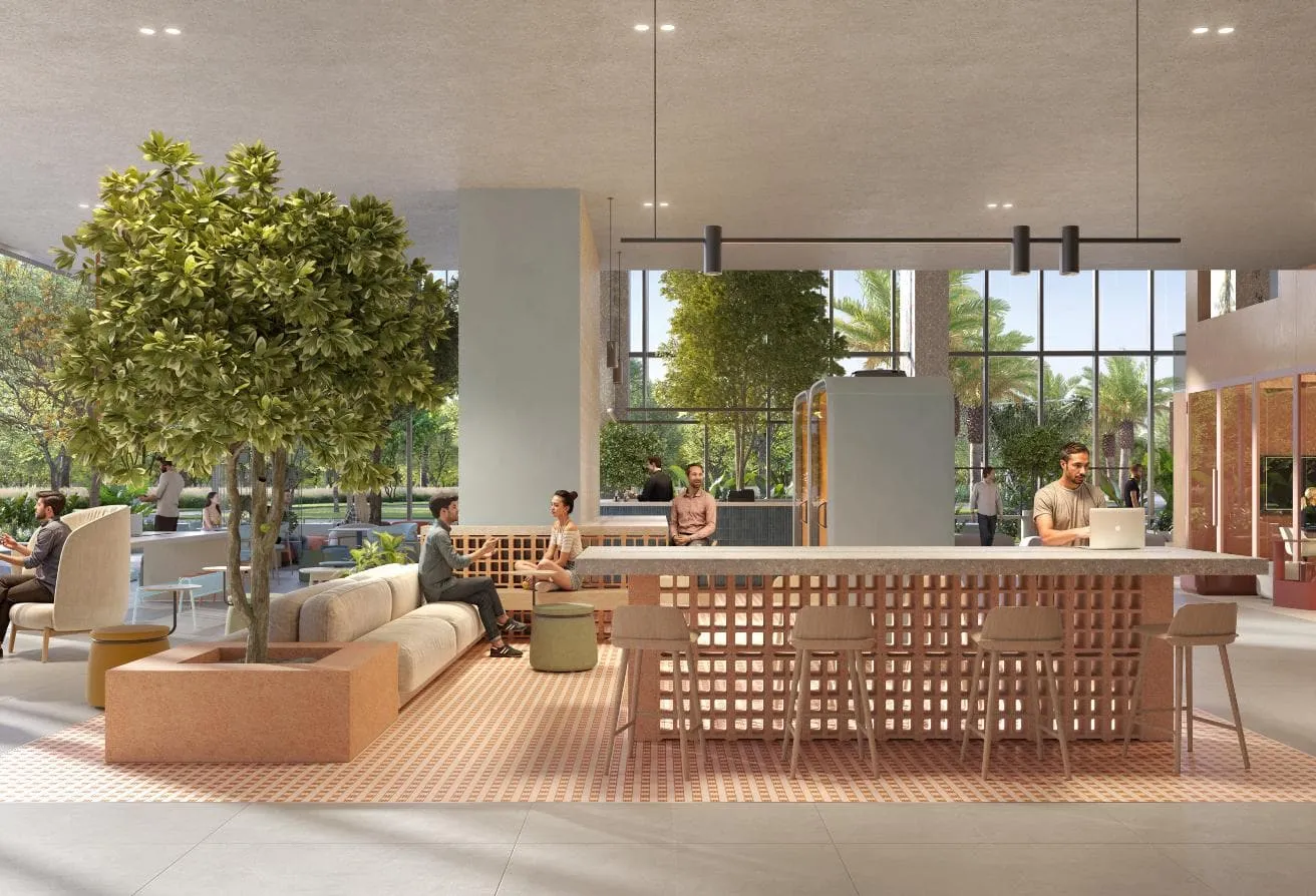 Render of the co-working lounge, with a long shared table and trees by tall windows