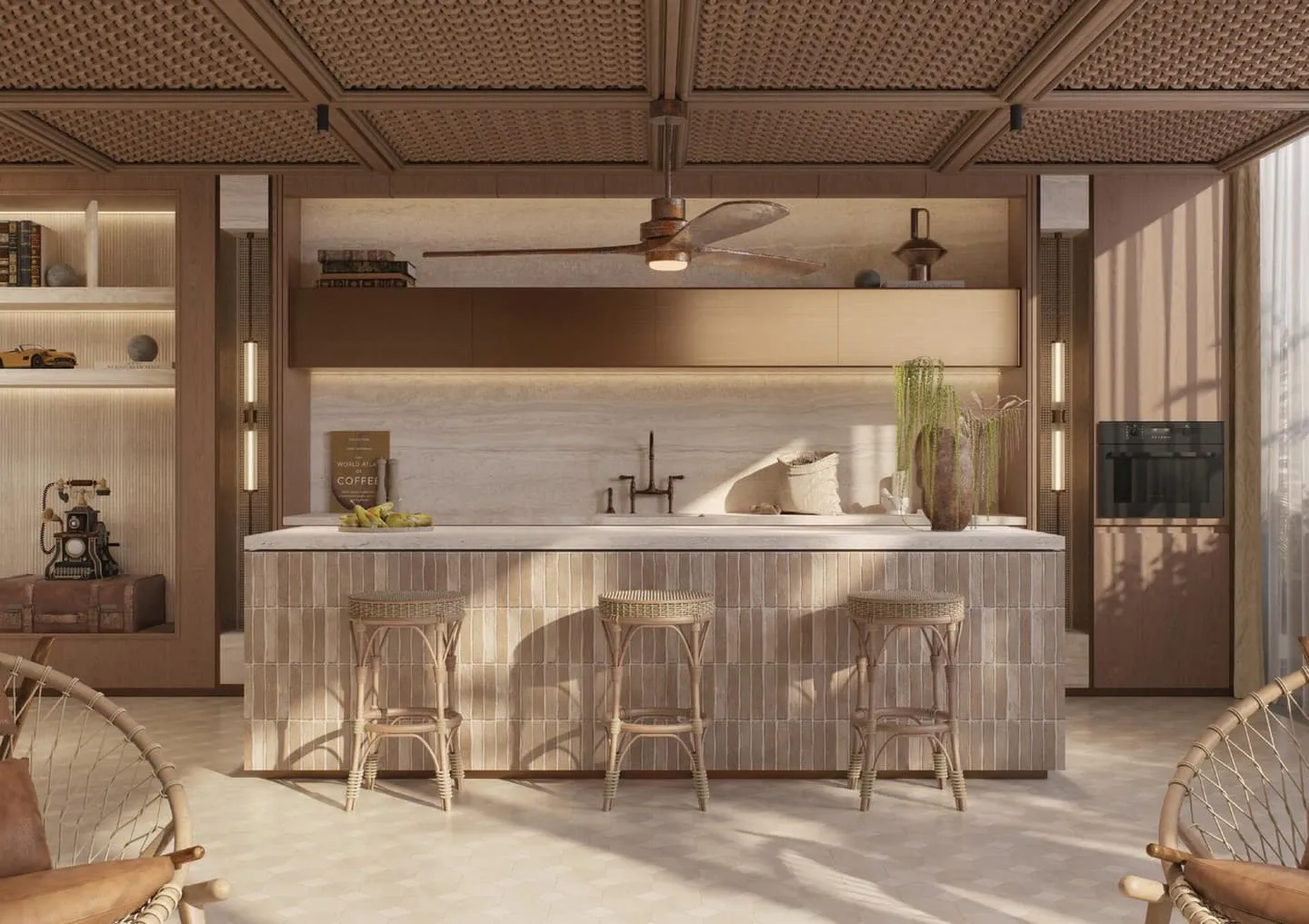 A shared kitchen with a tiled island, rattan stools and an oven set into the timber wall