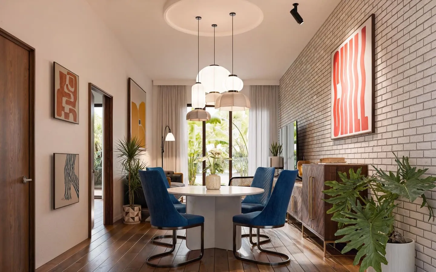 A dining nook with a round table, blue accent chairs and a bold entryway artwork.