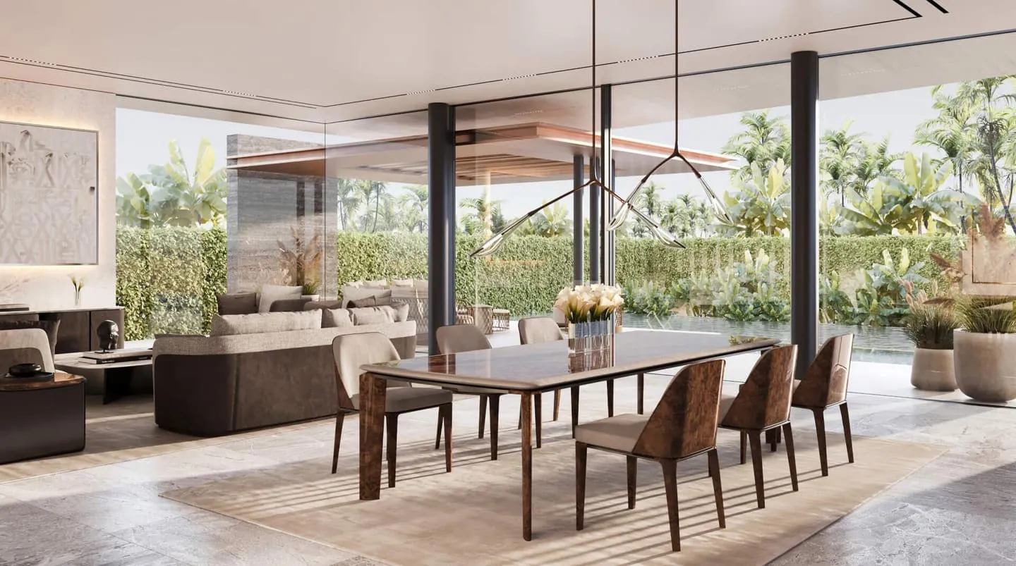 A Bentley Home dining area at a timber table looking onto the garden