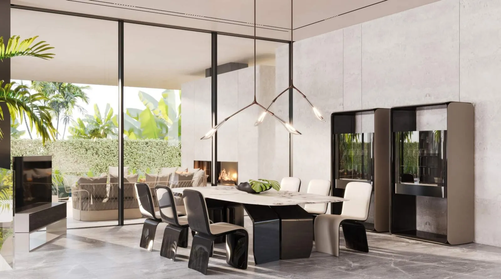 A Bentley Home dining room with a long table set beside full-height glazing