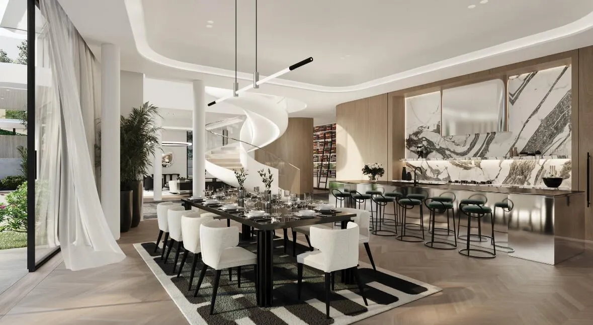 A Karl Lagerfeld dining room with a long table, sheer curtains and the marble kitchen behind