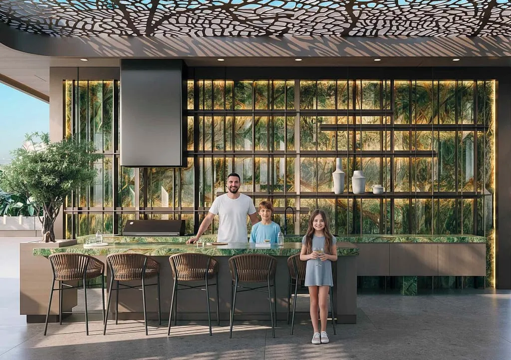 Residents at a long dining counter, a screen and a planted green wall behind them