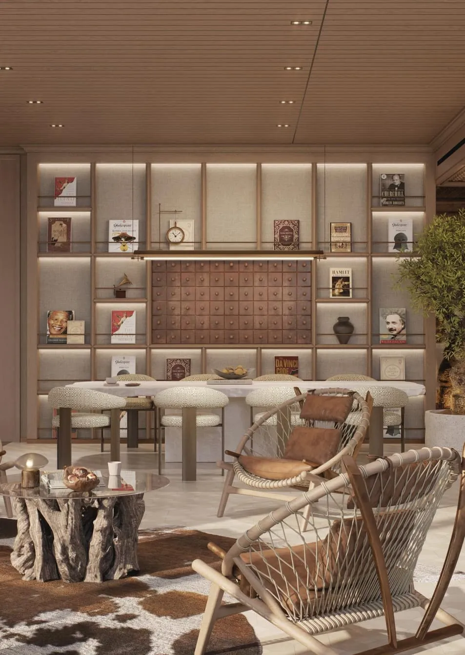 Lit display shelving holding books and objects behind a communal table with woven stools
