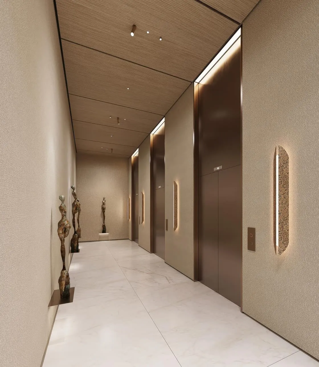 The elevator corridor lined with sculptures set into lit wall niches