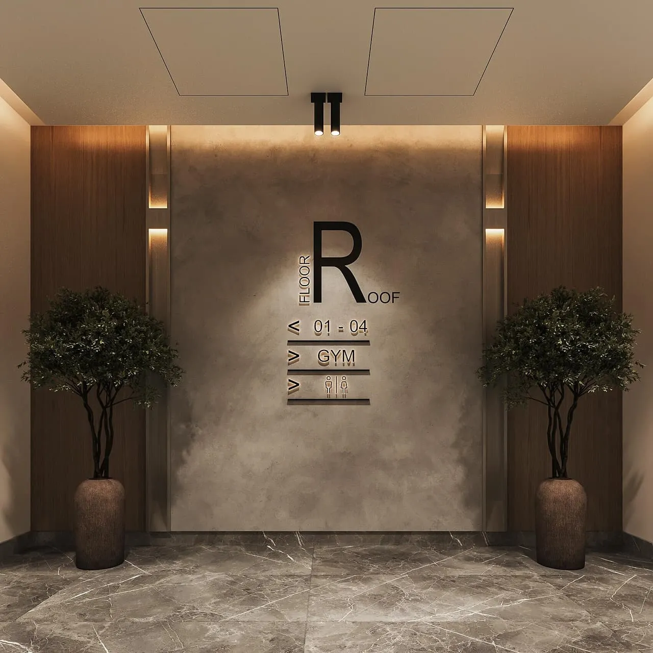 The entrance lobby, the building monogram lit on a stone wall between two planters