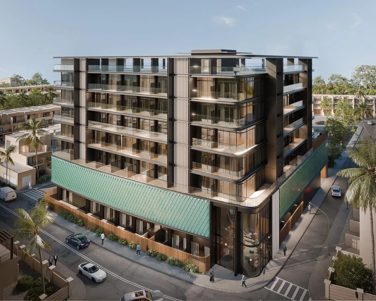 The building's entrance canopy and ground-floor retail frontage along a landscaped street.