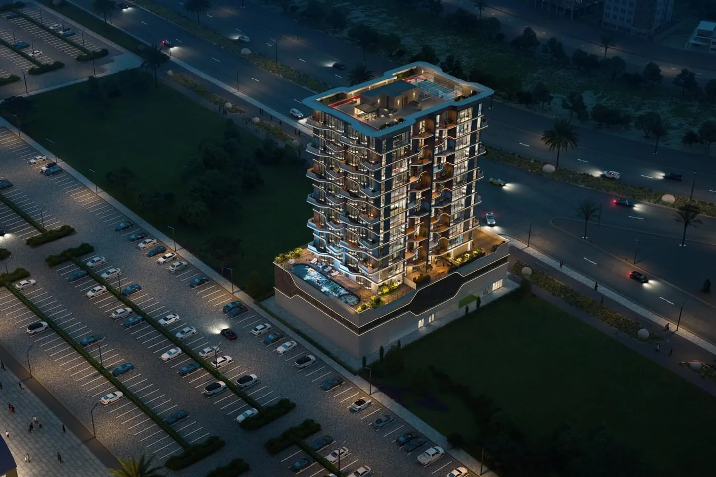 Aerial night view of the illuminated tower amid the surrounding development