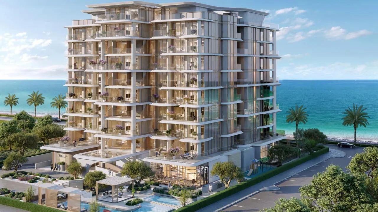 A low-rise on a Palm Jumeirah frond road, the beach and open sea running along both sides