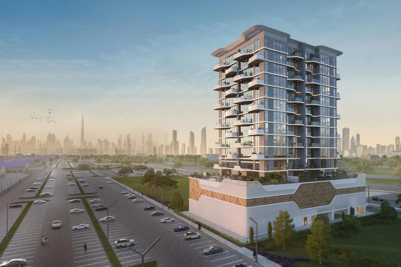 Wide daytime view of the tower from the boulevard, set against the city skyline