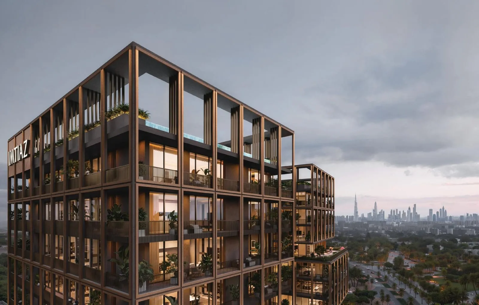The crowning volume at dusk, an open roof frame over planted balconies and a distant skyline beyond