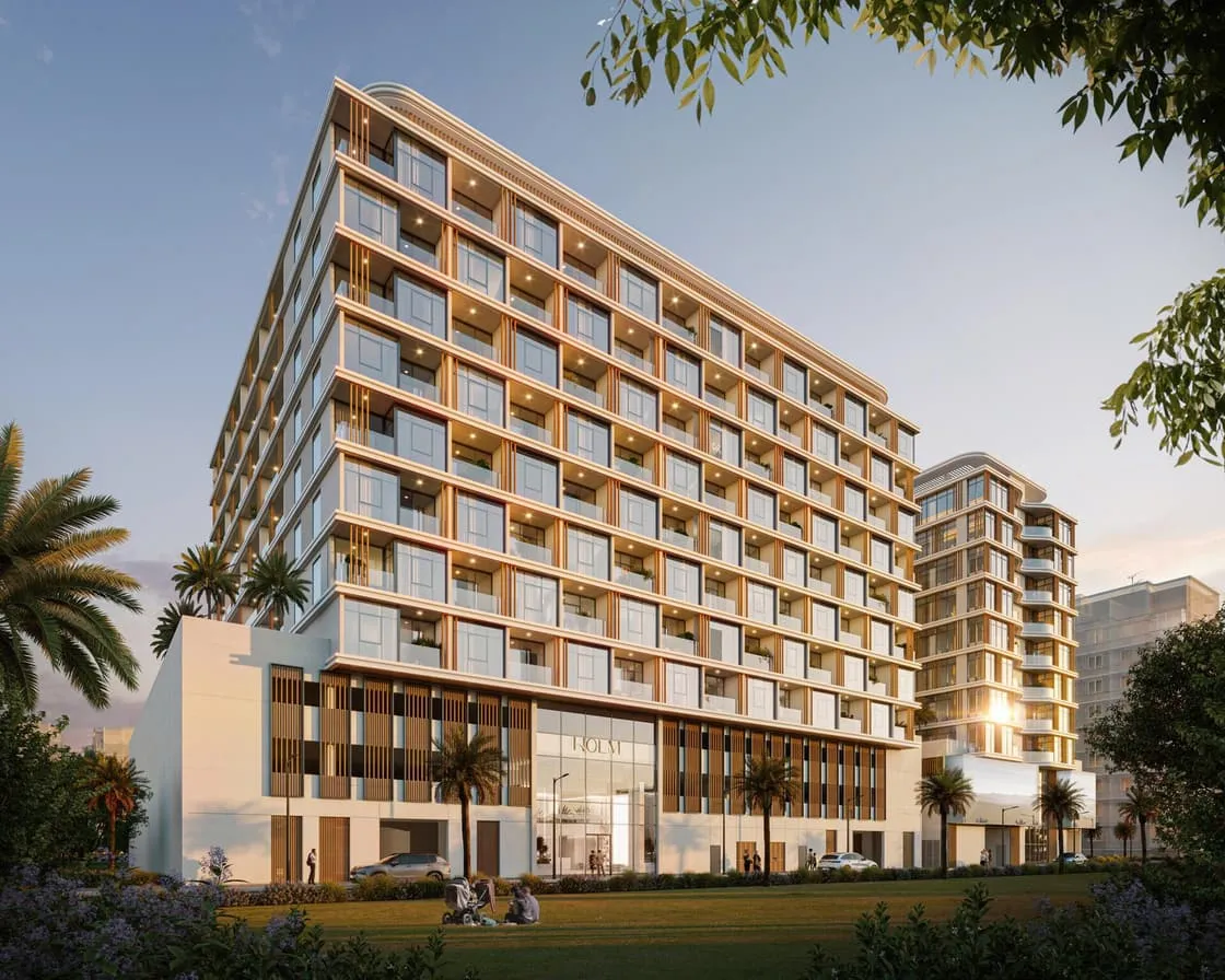 Holm One's facade in daylight, timber-slat balconies above a palm-lined street