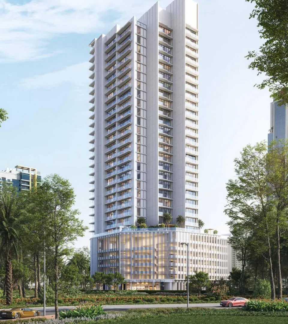 The same tower by day, its stacked white balcony slabs rising above a louvred podium among mature trees