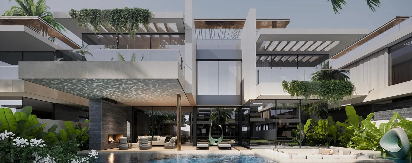 A branded residential building at dusk, its terraces lit from within