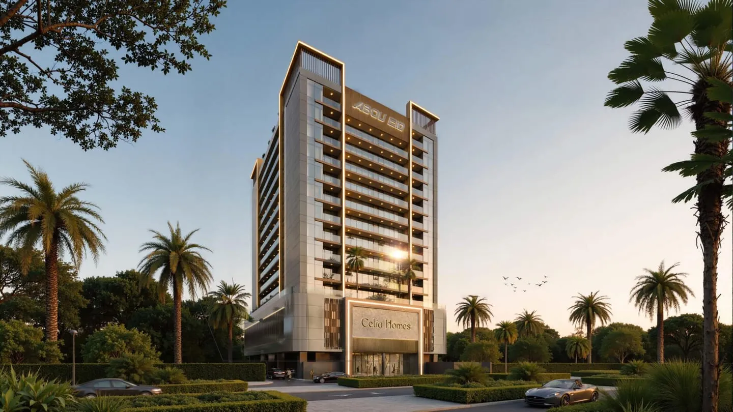 Celia Homes at golden hour, the tower's lit crown band rising above a palm-lined approach road