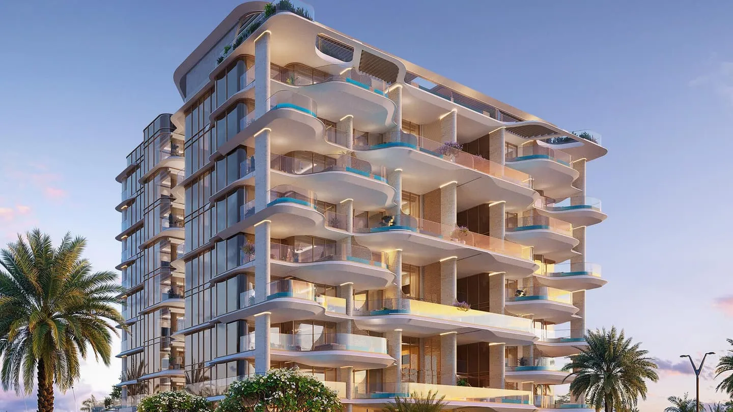 The facade between palms, the curved balcony bands running its full width