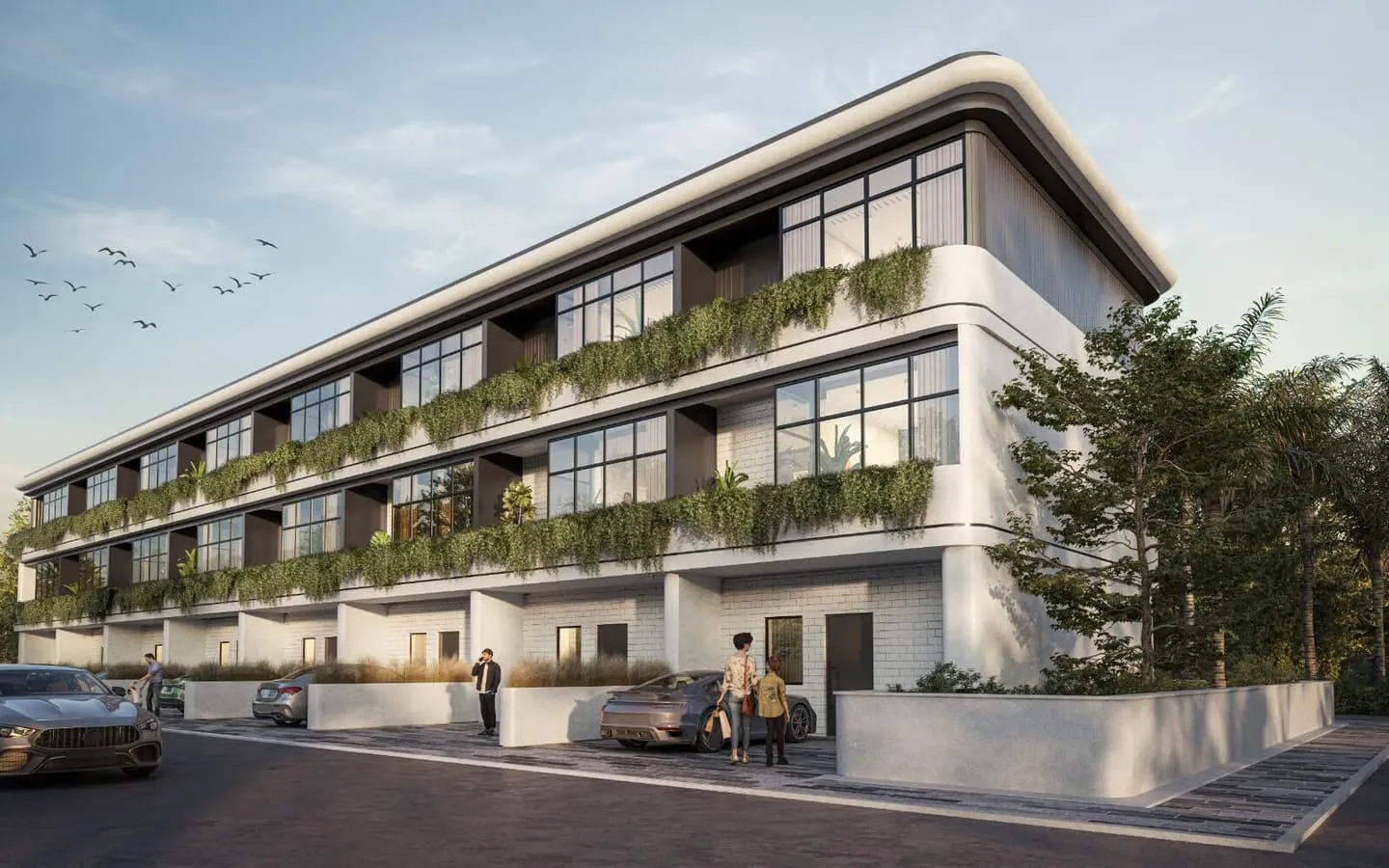 A three-storey Taormina Village townhouse terrace seen from the street, greenery trailing from every balcony