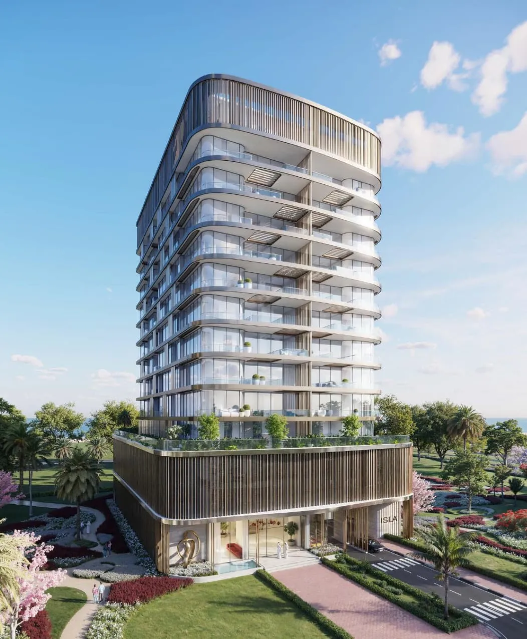 The tower from the approach road, balconies curving around each floor above a slatted podium with the project name at the entrance
