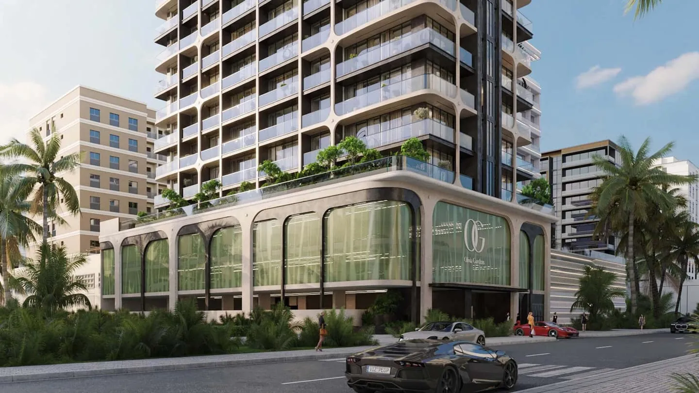 Olivia Gardens Residence from the street, its planted podium and monogrammed screen wrapping the corner