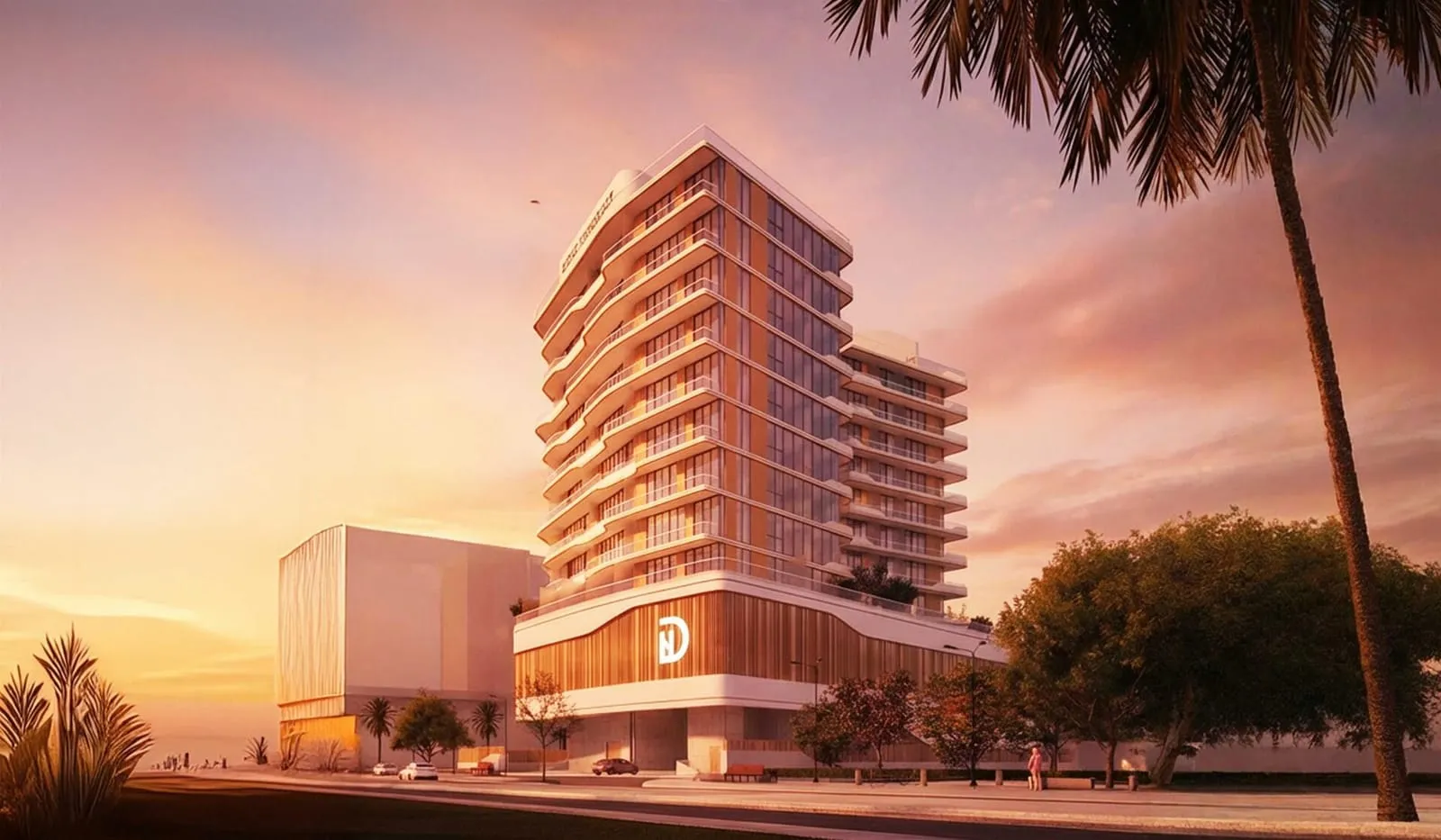 A wide view of the building at sunset, framed by palm fronds with low-rise Wadi Al Safa 5 stretching behind it