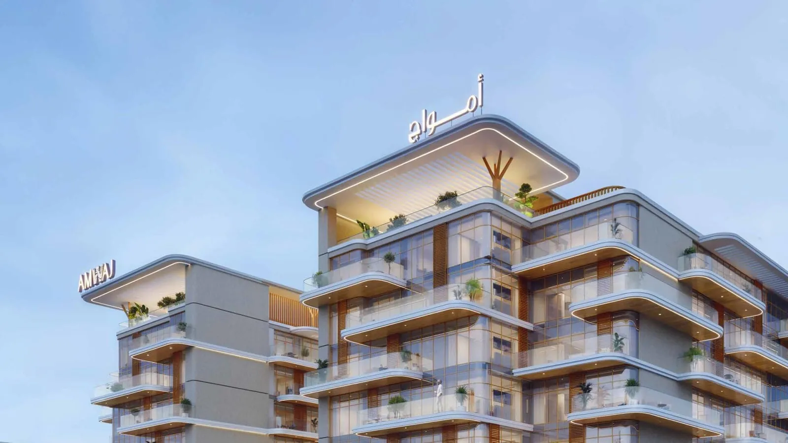The upper floors from across the road, planted terraces stepping back under the sign on the roofline