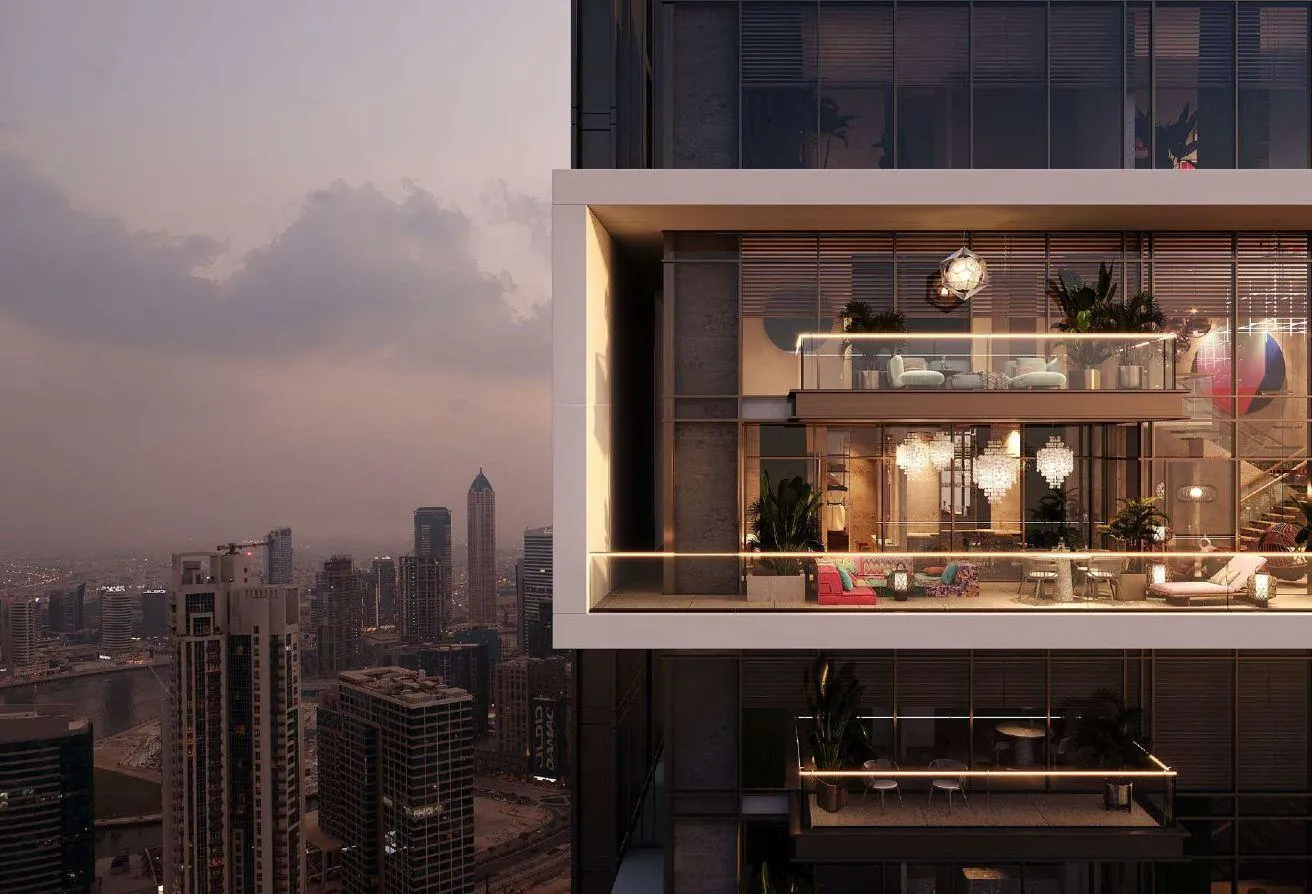 Render of a glass-fronted box projecting from the facade, lit at dusk above the city