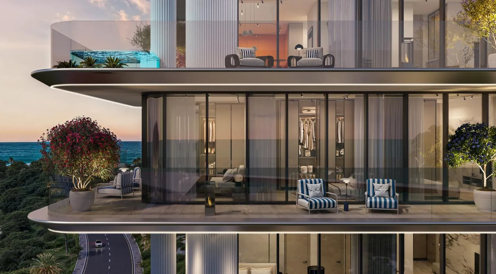 The cantilevered terrace floors seen from the street, sun loungers on the top deck above full-height glazing