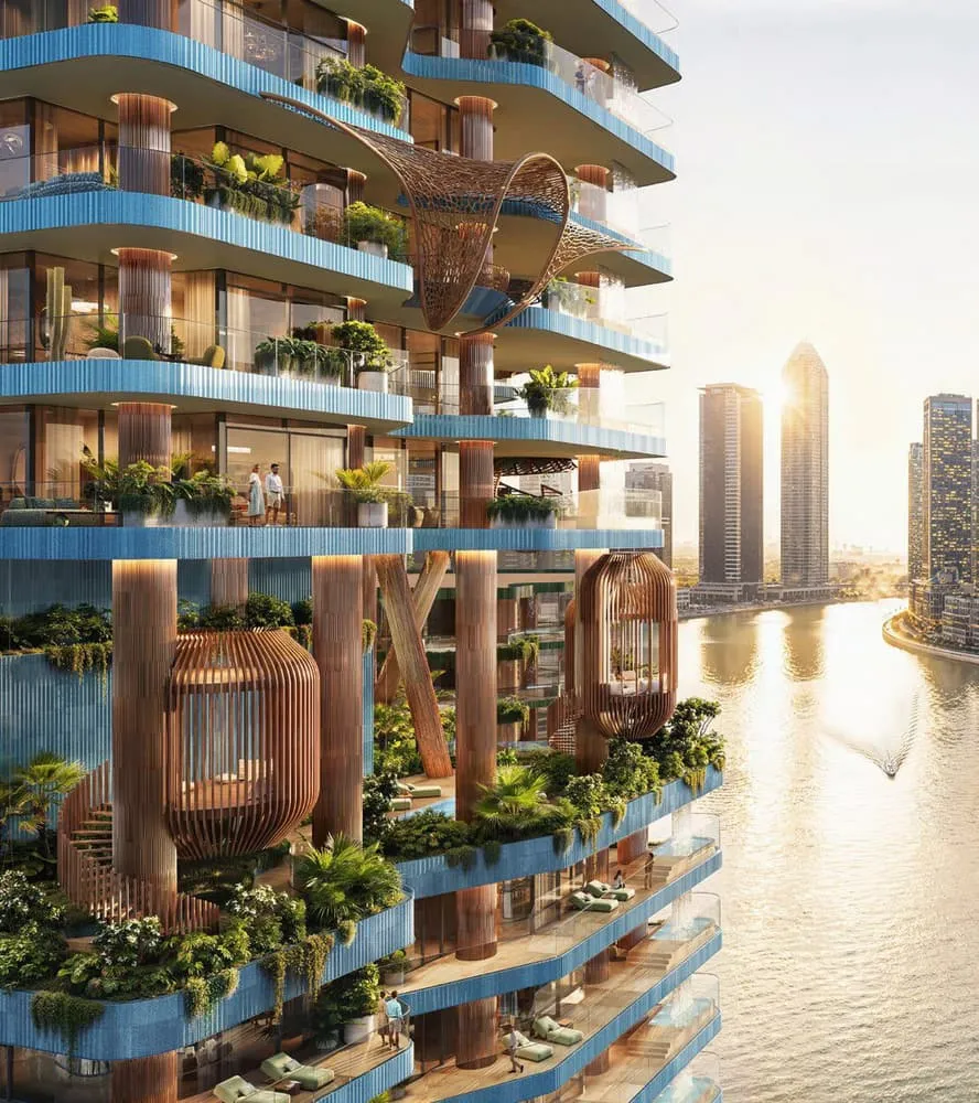 The balcony stack at golden hour, a woven rattan pod hanging beneath one slab above the water