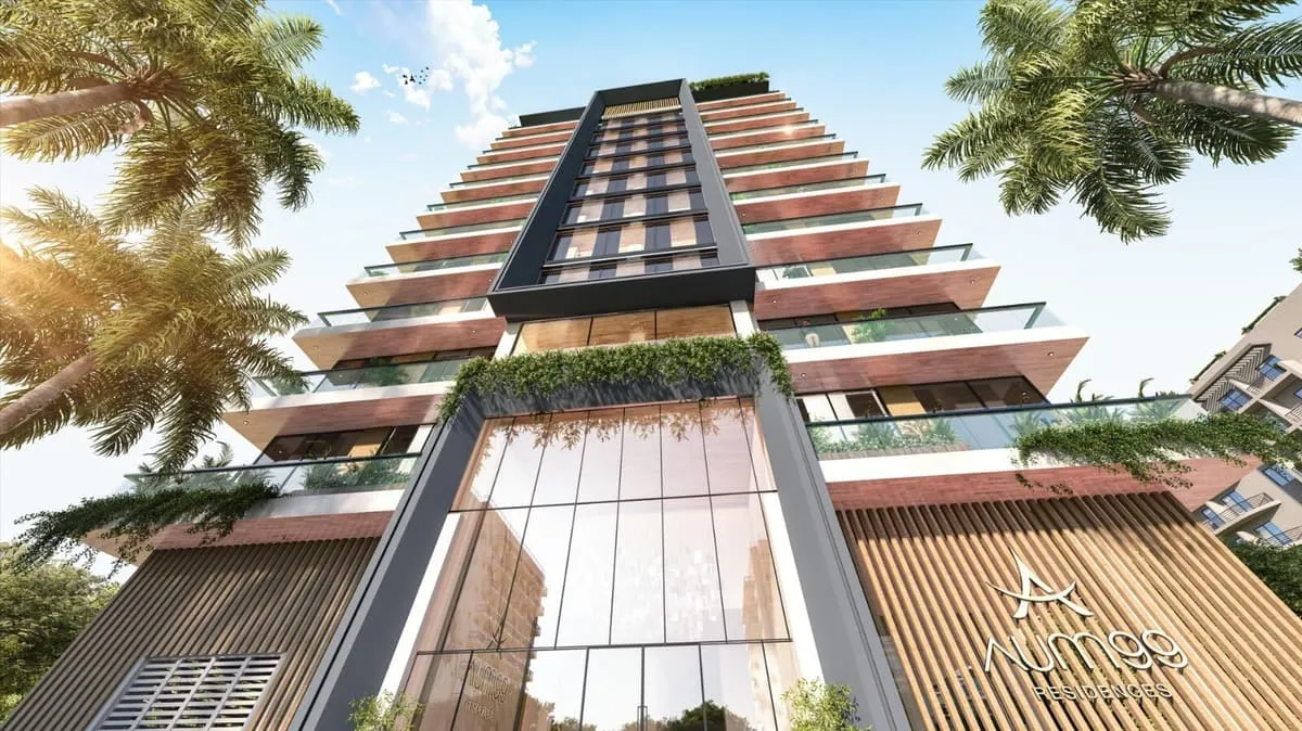 The facade seen looking straight up, timber-lined balcony soffits stepping away towards the sky
