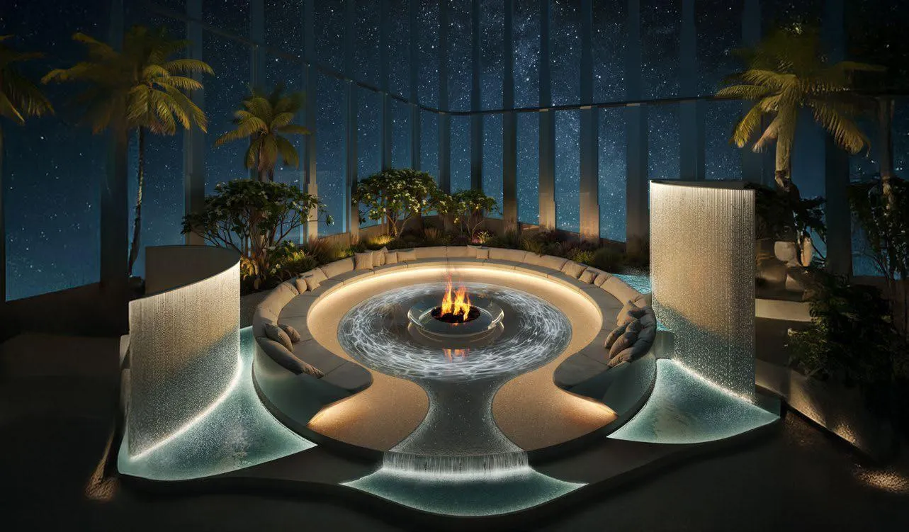 A circular fire bowl at night, curved seating pods set around the flame beneath palms