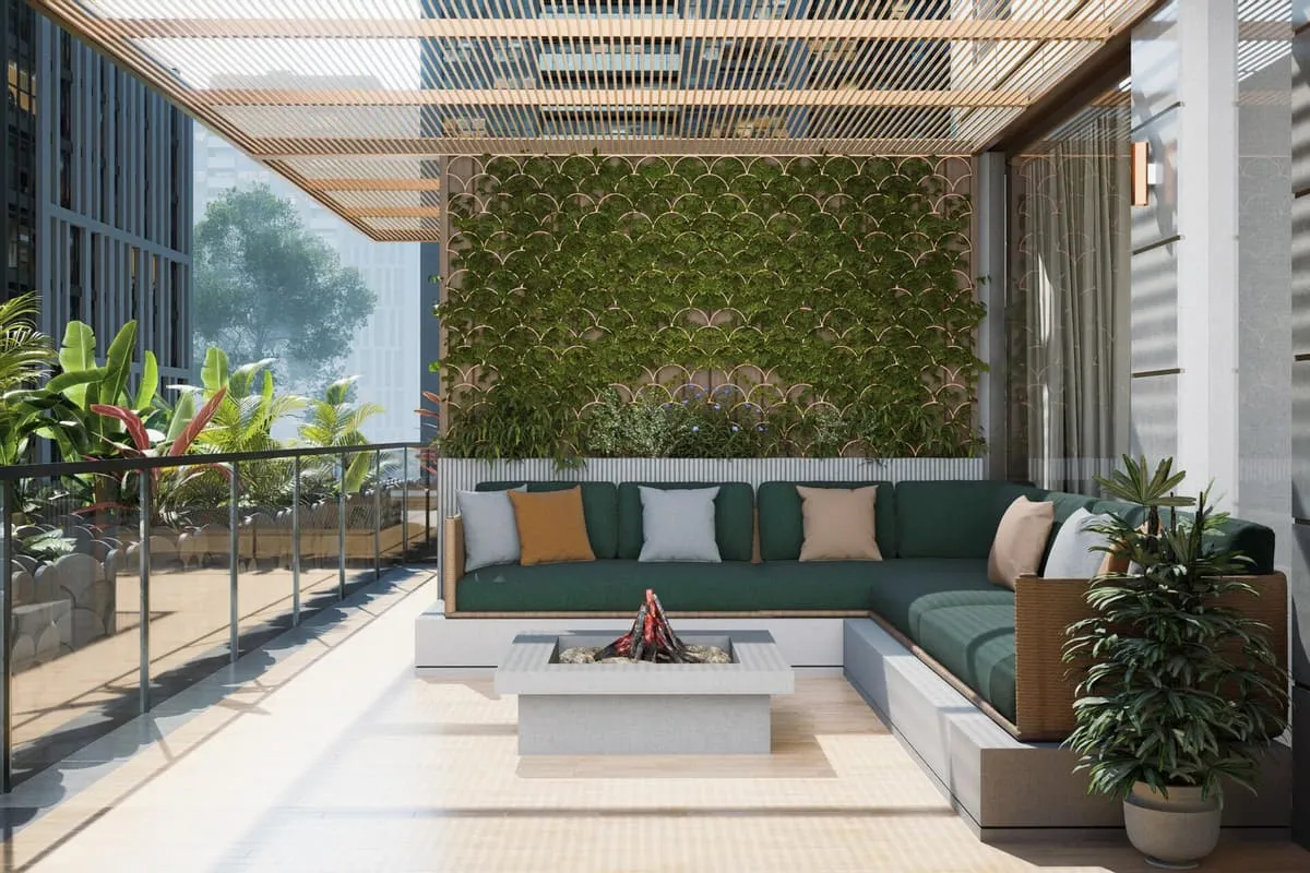 An outdoor lounge area with a fire-pit table set against the Dubai skyline