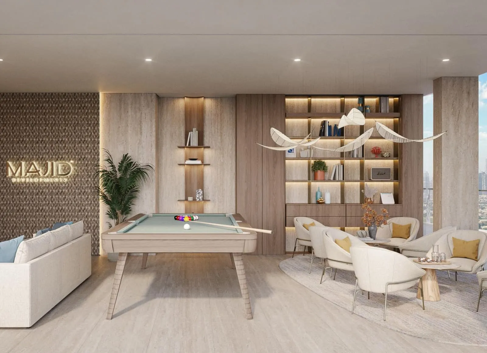 A games lounge with a pool table, armchairs by the window and the developer's name lit on a patterned wall