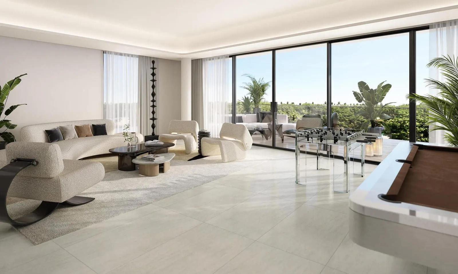 A long Karl Lagerfeld living space with a games table set against the glazed wall