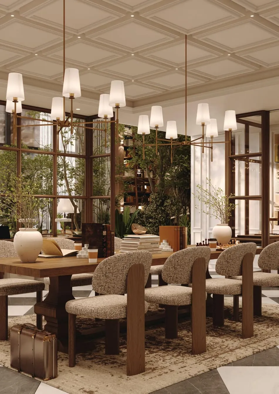 A dining table beside a glazed courtyard planted with trees, bookshelves visible through the glass