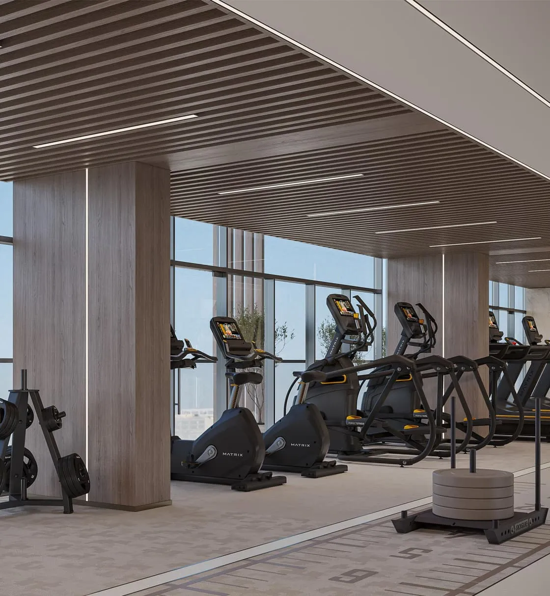 Fully equipped gym with cardio machines at Linea by Holm.