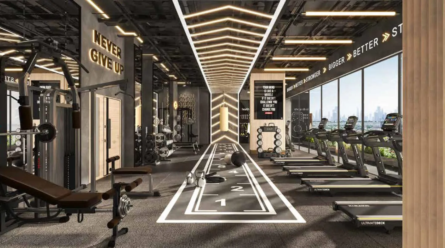 The gym cardio floor, treadmills lined along a mirrored room under angular ceiling lighting