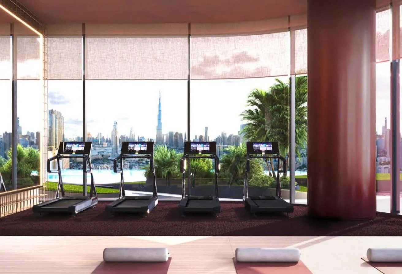 Render of a row of treadmills facing a window onto the skyline